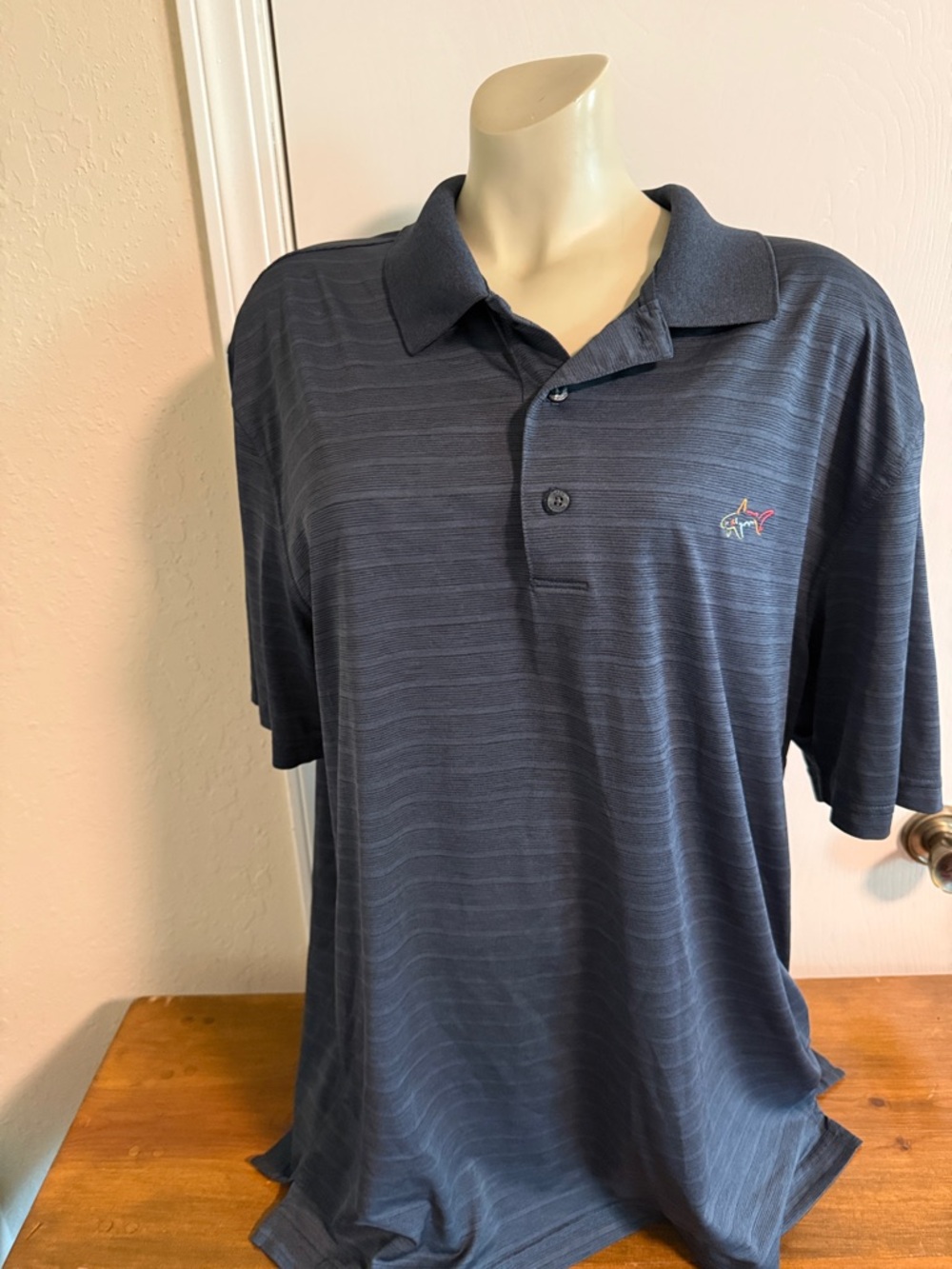 Greg Norman Collection Navy Subtle Striped Polo with Shark Logo